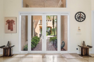 This stunning and meticulously maintained two-story courtyard on Country Club At Mirasol in Florida - for sale on GolfHomes.com, golf home, golf lot