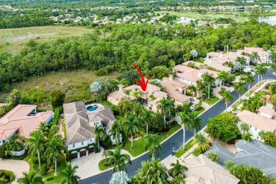 This stunning and meticulously maintained two-story courtyard on Country Club At Mirasol in Florida - for sale on GolfHomes.com, golf home, golf lot