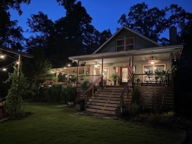 This private and peaceful lakefront home is located in the piney on Pine Dunes Golf Course in Texas - for sale on GolfHomes.com, golf home, golf lot