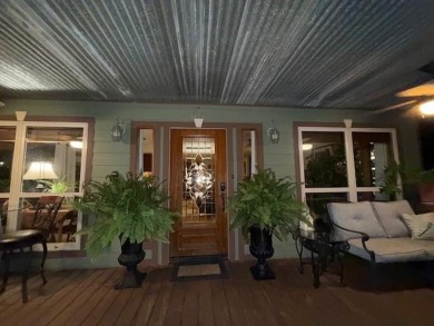 This private and peaceful lakefront home is located in the piney on Pine Dunes Golf Course in Texas - for sale on GolfHomes.com, golf home, golf lot
