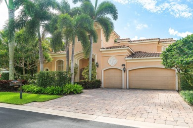 This stunning and meticulously maintained two-story courtyard on Country Club At Mirasol in Florida - for sale on GolfHomes.com, golf home, golf lot