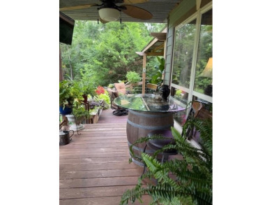 This private and peaceful lakefront home is located in the piney on Pine Dunes Golf Course in Texas - for sale on GolfHomes.com, golf home, golf lot