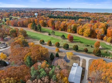 Classic bi-level looking over the 6th fairway of the Charlevoix on Charlevoix Golf Club in Michigan - for sale on GolfHomes.com, golf home, golf lot