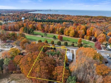 Classic bi-level looking over the 6th fairway of the Charlevoix on Charlevoix Golf Club in Michigan - for sale on GolfHomes.com, golf home, golf lot