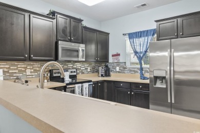 Welcome to this FIRST FLOOR 2-bedroom, 2-bath condo located in on Barefoot Resort and Golf Club  in South Carolina - for sale on GolfHomes.com, golf home, golf lot