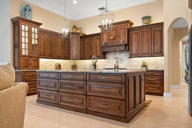 Discover luxury living in this beautifully updated pool home in on PGA Golf Club in PGA Village in Florida - for sale on GolfHomes.com, golf home, golf lot