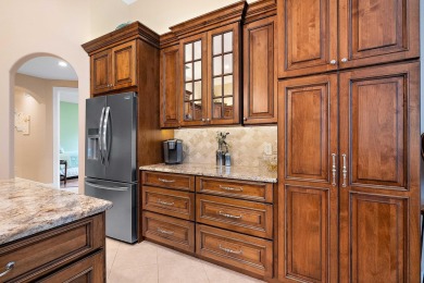 Discover luxury living in this beautifully updated pool home in on PGA Golf Club in PGA Village in Florida - for sale on GolfHomes.com, golf home, golf lot