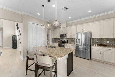 Discover peace and tranquility in this stunning premium on Eagle Creek Golf Club in Florida - for sale on GolfHomes.com, golf home, golf lot