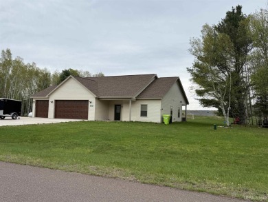 This is still like a brand new home! Seller bought in 2023 and on Portage Lake Golf Course in Michigan - for sale on GolfHomes.com, golf home, golf lot