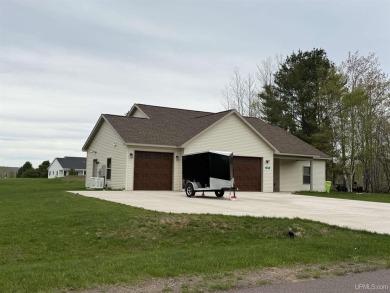 This is still like a brand new home! Seller bought in 2023 and on Portage Lake Golf Course in Michigan - for sale on GolfHomes.com, golf home, golf lot