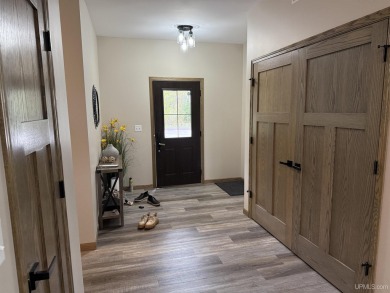 This is still like a brand new home! Seller bought in 2023 and on Portage Lake Golf Course in Michigan - for sale on GolfHomes.com, golf home, golf lot