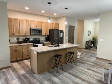 This is still like a brand new home! Seller bought in 2023 and on Portage Lake Golf Course in Michigan - for sale on GolfHomes.com, golf home, golf lot