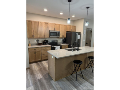 This is still like a brand new home! Seller bought in 2023 and on Portage Lake Golf Course in Michigan - for sale on GolfHomes.com, golf home, golf lot