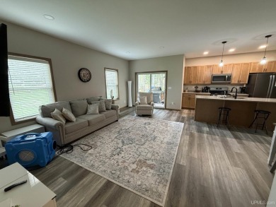 This is still like a brand new home! Seller bought in 2023 and on Portage Lake Golf Course in Michigan - for sale on GolfHomes.com, golf home, golf lot