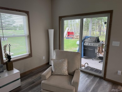 This is still like a brand new home! Seller bought in 2023 and on Portage Lake Golf Course in Michigan - for sale on GolfHomes.com, golf home, golf lot