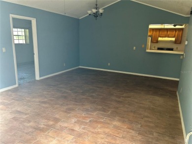 FANTASTIC INVESTMENT OPPORTUNITY TO PICK UP THIS FIXER UPPER IN on Seven Springs Golf and Country Club in Florida - for sale on GolfHomes.com, golf home, golf lot