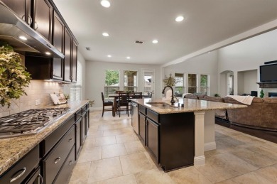 Tucked inside a quiet gated community just steps from Lake on The Tribute At the Colony in Texas - for sale on GolfHomes.com, golf home, golf lot