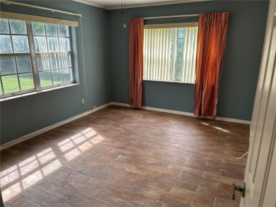 FANTASTIC INVESTMENT OPPORTUNITY TO PICK UP THIS FIXER UPPER IN on Seven Springs Golf and Country Club in Florida - for sale on GolfHomes.com, golf home, golf lot