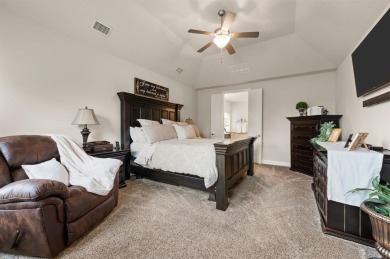 Tucked inside a quiet gated community just steps from Lake on The Tribute At the Colony in Texas - for sale on GolfHomes.com, golf home, golf lot