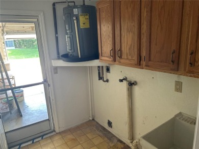 FANTASTIC INVESTMENT OPPORTUNITY TO PICK UP THIS FIXER UPPER IN on Seven Springs Golf and Country Club in Florida - for sale on GolfHomes.com, golf home, golf lot