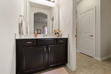 Tucked inside a quiet gated community just steps from Lake on The Tribute At the Colony in Texas - for sale on GolfHomes.com, golf home, golf lot