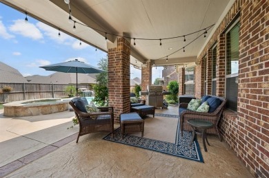 Tucked inside a quiet gated community just steps from Lake on The Tribute At the Colony in Texas - for sale on GolfHomes.com, golf home, golf lot