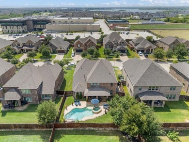 Tucked inside a quiet gated community just steps from Lake on The Tribute At the Colony in Texas - for sale on GolfHomes.com, golf home, golf lot