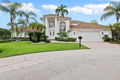 Welcome to this luxurious home featuring soaring ceilings on Weston Hills Country Club in Florida - for sale on GolfHomes.com, golf home, golf lot