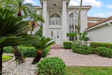 Welcome to this luxurious home featuring soaring ceilings on Weston Hills Country Club in Florida - for sale on GolfHomes.com, golf home, golf lot