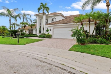 Welcome to this luxurious home featuring soaring ceilings on Weston Hills Country Club in Florida - for sale on GolfHomes.com, golf home, golf lot