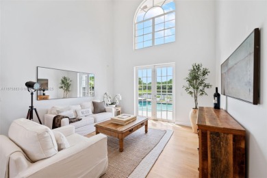Welcome to this luxurious home featuring soaring ceilings on Weston Hills Country Club in Florida - for sale on GolfHomes.com, golf home, golf lot