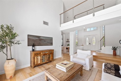 Welcome to this luxurious home featuring soaring ceilings on Weston Hills Country Club in Florida - for sale on GolfHomes.com, golf home, golf lot