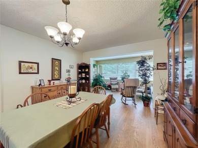 Welcome to this beautifully maintained 2-bedroom, 2-bath end on On Top of the World Golf Course in Florida - for sale on GolfHomes.com, golf home, golf lot
