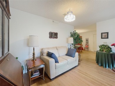 Welcome to this beautifully maintained 2-bedroom, 2-bath end on On Top of the World Golf Course in Florida - for sale on GolfHomes.com, golf home, golf lot