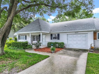Welcome to this beautifully maintained 2-bedroom, 2-bath end on On Top of the World Golf Course in Florida - for sale on GolfHomes.com, golf home, golf lot