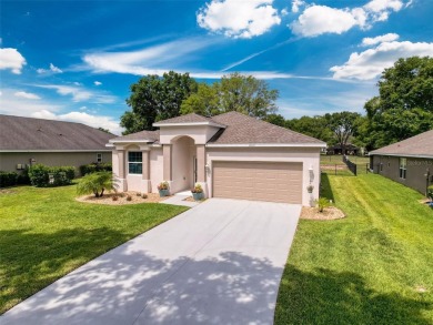 Enjoy Florida living at its finest in this beautifully on Meadow Oaks Golf and Country Club in Florida - for sale on GolfHomes.com, golf home, golf lot