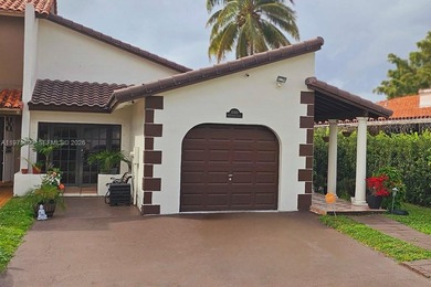 One-of-a-kind Mediterranean-style single-family townhouse with on Country Club of Miami in Florida - for sale on GolfHomes.com, golf home, golf lot