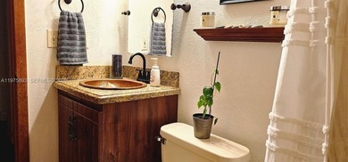 One-of-a-kind Mediterranean-style single-family townhouse with on Country Club of Miami in Florida - for sale on GolfHomes.com, golf home, golf lot