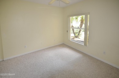 Golf Villa with an amazing golf and water view! This bright and on Turnbull Bay Golf Club in Florida - for sale on GolfHomes.com, golf home, golf lot