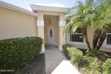 Golf Villa with an amazing golf and water view! This bright and on Turnbull Bay Golf Club in Florida - for sale on GolfHomes.com, golf home, golf lot