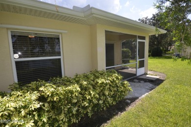 Golf Villa with an amazing golf and water view! This bright and on Turnbull Bay Golf Club in Florida - for sale on GolfHomes.com, golf home, golf lot