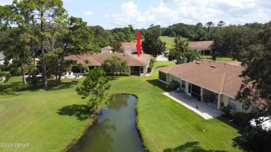 Golf Villa with an amazing golf and water view! This bright and on Turnbull Bay Golf Club in Florida - for sale on GolfHomes.com, golf home, golf lot