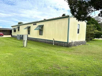 MOTIVATED SELLERS! HOME IS PRICED TO SELL. 2-BEDROOM, 2-BATHROOM on Anglers Green Golf Course in Florida - for sale on GolfHomes.com, golf home, golf lot