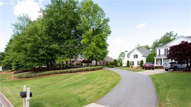 Hampton Golf Village! Stunning 3 sided brick home features the on Hampton Golf Village in Georgia - for sale on GolfHomes.com, golf home, golf lot