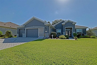 Stunning home loaded with upgrades on a deep semi-private lot on Eagle Ridge At Spruce Creek Country Club in Florida - for sale on GolfHomes.com, golf home, golf lot