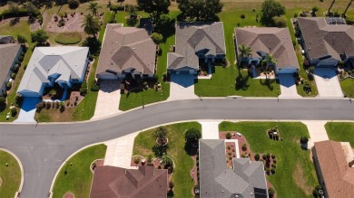 Stunning home loaded with upgrades on a deep semi-private lot on Eagle Ridge At Spruce Creek Country Club in Florida - for sale on GolfHomes.com, golf home, golf lot