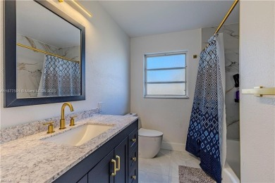 This gorgeous 4 bedroom, 2 bath pool home in the historic Palm on Fort Myers Country Club in Florida - for sale on GolfHomes.com, golf home, golf lot