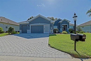 Stunning home loaded with upgrades on a deep semi-private lot on Eagle Ridge At Spruce Creek Country Club in Florida - for sale on GolfHomes.com, golf home, golf lot
