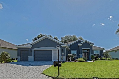 Stunning home loaded with upgrades on a deep semi-private lot on Eagle Ridge At Spruce Creek Country Club in Florida - for sale on GolfHomes.com, golf home, golf lot