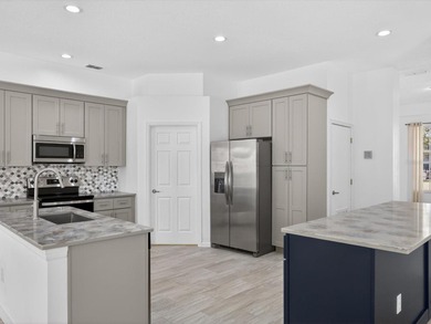 Located in a gated golf course community, 411 Boxwood Dr has on Ridgewood Lakes Golf and Country Club in Florida - for sale on GolfHomes.com, golf home, golf lot